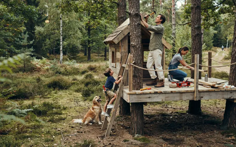 Rustic DIY treehouse made from reclaimed timber.